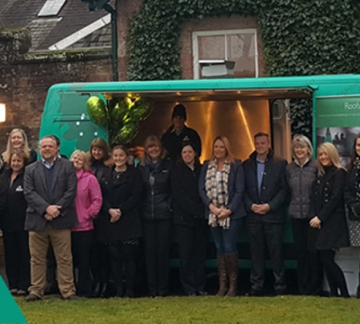 Members of the A.Proctor Group team gather outside their UK tour van