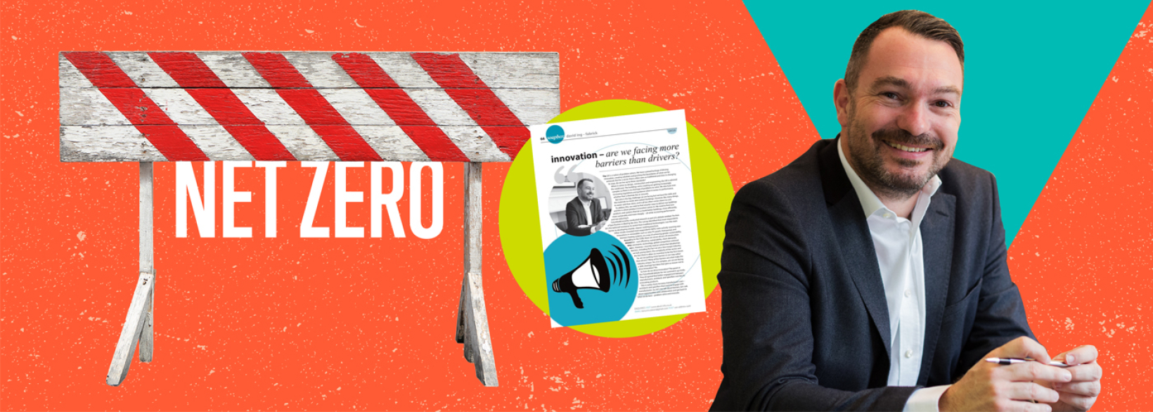 Fabrick MD, David Ing seated next to a magazine article and a construction barrier